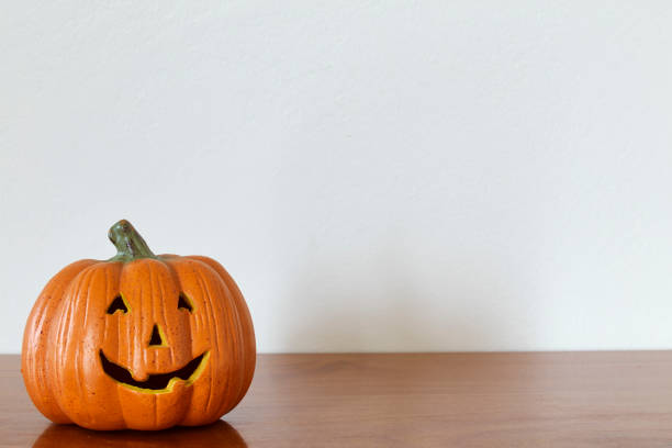 istock Halloween Pumpkin miniature decoration isolated on white background. 1026434730