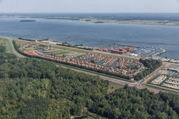 Aerial view recreation park and harbor in Dutch province Flevoland Aerial view recreation park with holiday homes and harbor in Dutch province Flevoland biddinghuizen stock pictures, royalty-free photos & images