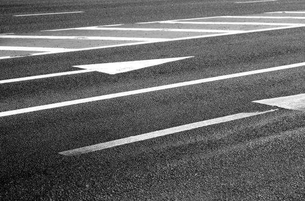 istock Urban asphalt road with arrows and marks on it. 1026435426