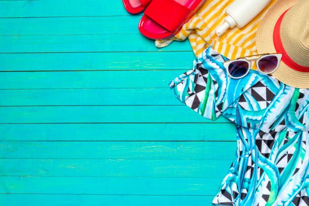 istock Composition with swimsuit on color wooden background 1026448028