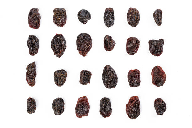 Dark raisins isoalted on white background Dark raisins isoalted on white background raisin stock pictures, royalty-free photos & images