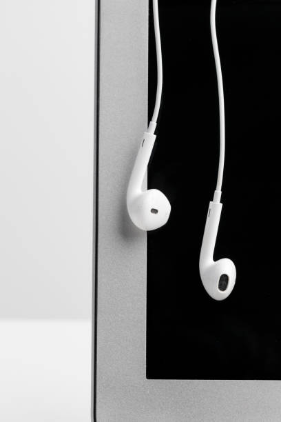 istock Music concept - Headphones over laptop 1026451002