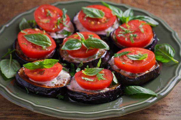 istock Aubergines with tomatoes and sauce. Pan fried eggplants 1026457322
