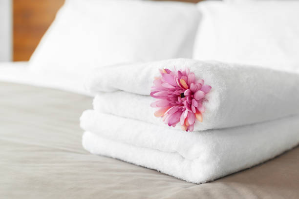 istock towels and flower on bed in hotel room 1026457698