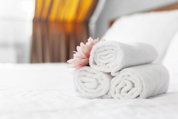 istock towels and flower on bed in hotel room 1026457728