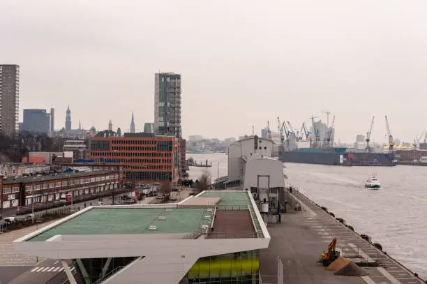 Hamburg, Germany - March 01, 2014: View from Dockland Building at Cruise Terminal Altona and Port of Hamburg at hazy day. Selective focus.