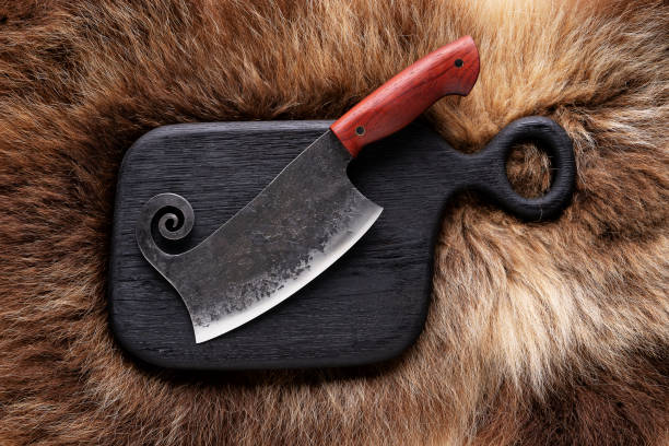 istock Hatchet on bear skin. Metal ax on a bear hide. 1026469190
