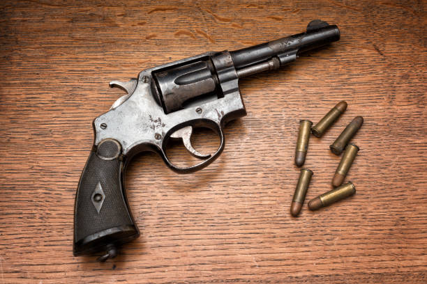 istock rusty revolver handgun and its six bullets 1026469814