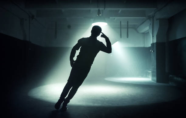 Young Man Silhouette Swinging in Hip Hop Dance
