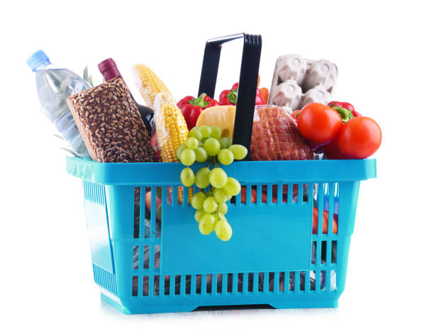 Plastic shopping basket with assorted grocery products Plastic shopping basket with assorted grocery products isolated on white feeding grapes stock pictures, royalty-free photos & images