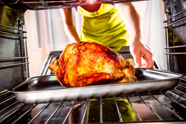 istock Cooking chicken in the oven at home. 1026473016