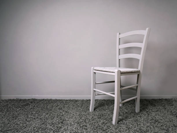 istock entirely gray room with empty chair and copy space 1026473026
