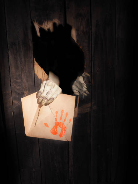 istock Zombie hand through hole cracked in rustic wood.Halloween theme 1026473156