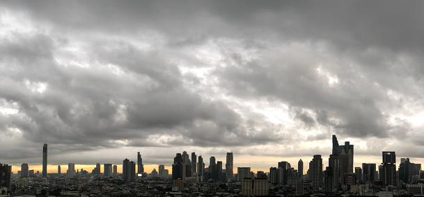 Panoramas of the skyscraper in downtown Bangkok cityscapes, the capital of Thailand in southeast Asia, with rain cloud and sunshine morning.