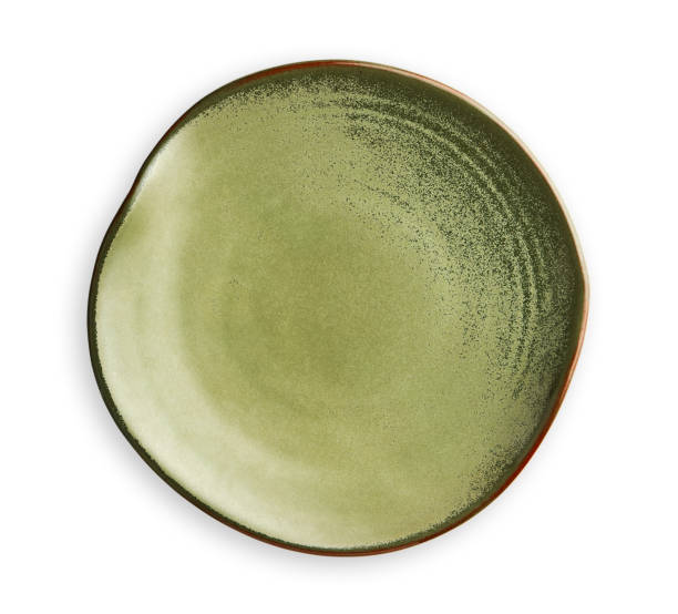 istock Empty green plate with wavy edge, Frilled plate in wavy pattern, View from above isolated on white background with clipping path 1026480512