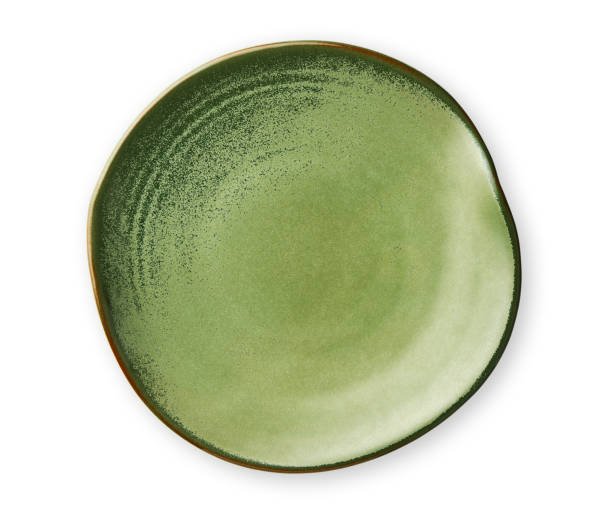 istock Empty green plate with wavy edge, Frilled plate in wavy pattern, View from above isolated on white background with clipping path 1026480514