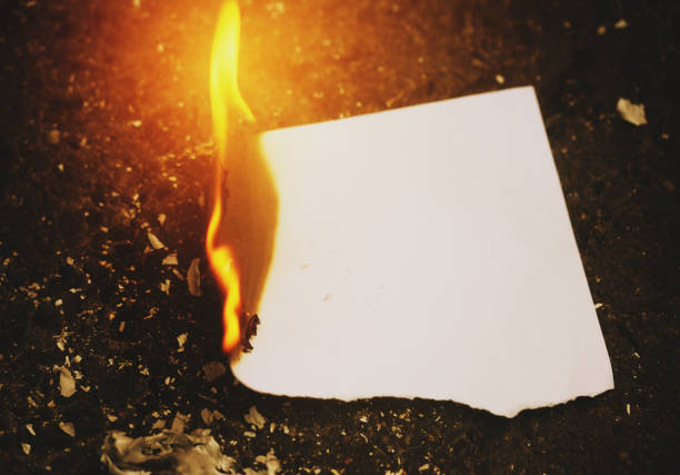 istock Blank piece of paper burning up 1026483724