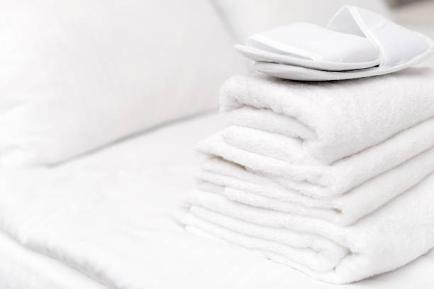 Clean towels on bed at hotel room
