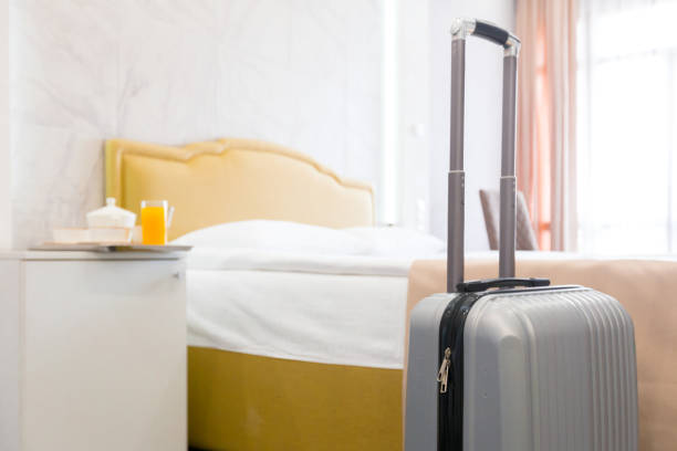 istock Suitcase or luggage bag in a modern hotel room 1026488034