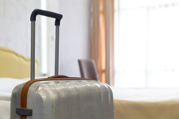 istock Suitcase or luggage bag in a modern hotel room 1026488130