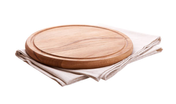 istock Board for pizza and tablecloth isolated on white. Canvas, dish towels on white background top view mock up. Selective focus. 1026488536
