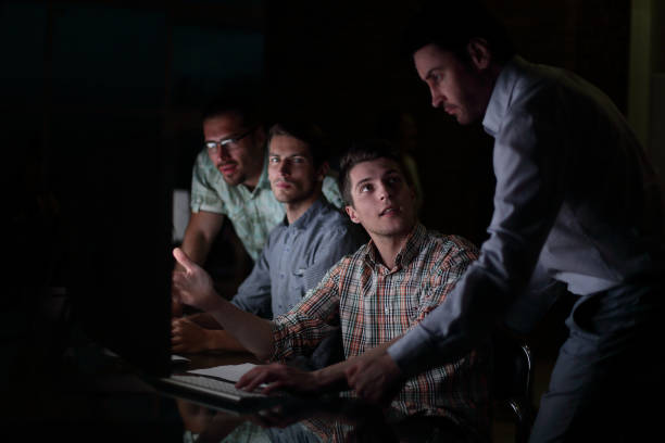 istock business team works overtime 1026489420