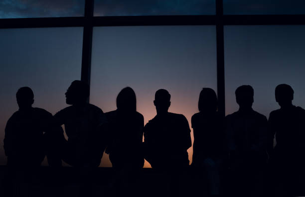 istock group of creative youth looks through the office windo 1026489768