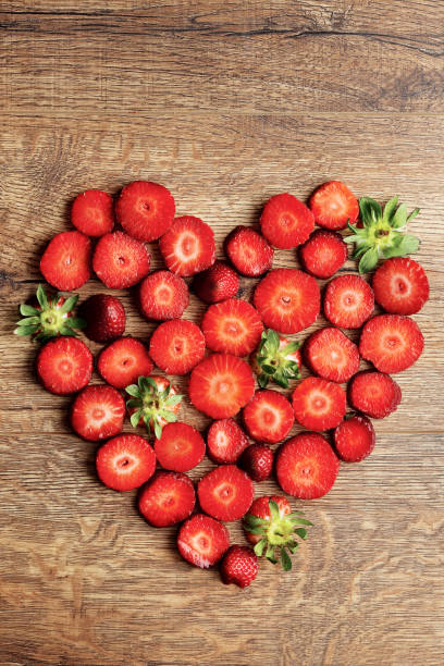 istock Fresh strawberries in the shape of heart 1026493796