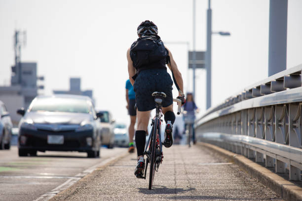Biker crossing a suspension bridge in Houston, Texas