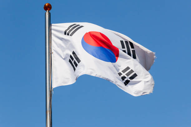 istock South Korea flag Taegukgi over blue sky 1026502832