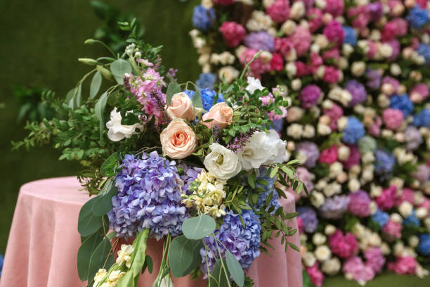 istock Flowered wedding wall. Decor with color hydrangea and roses. Wedding wall for ceremony and photo. 1026505584