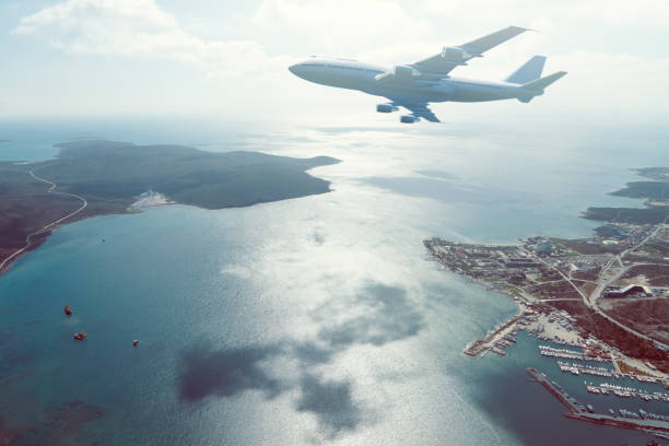 istock airplane flying over a coast city 1026510972