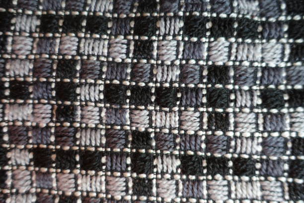 istock Top view of grey embroidered checkered fabric 1026514106