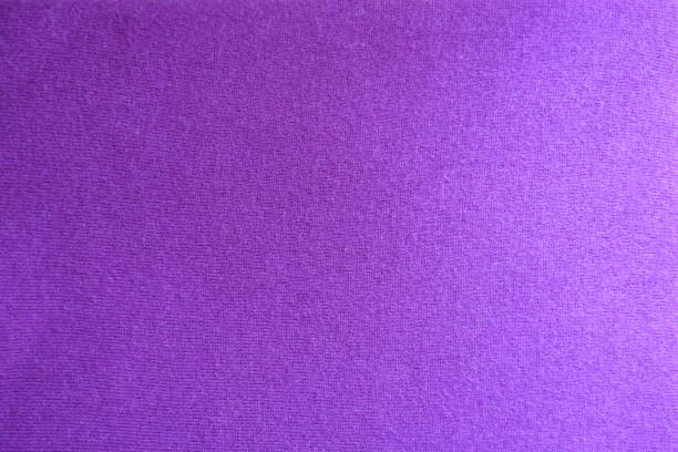 istock Surface of pinkish violet knitted fabric from above 1026514412