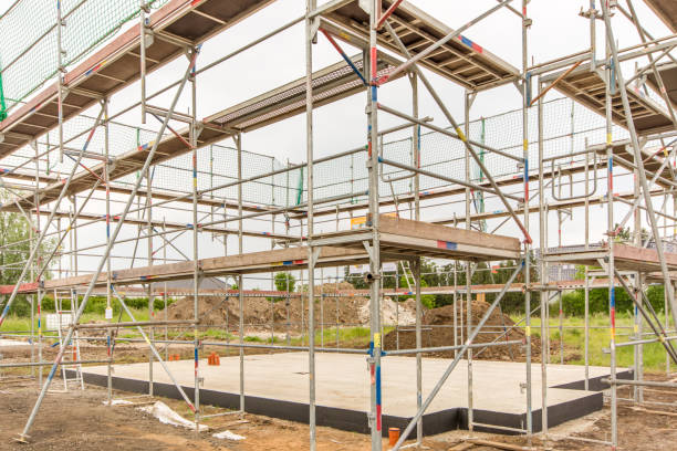 istock Base plate of the foundation surrounded by a scaffolding 1026514904