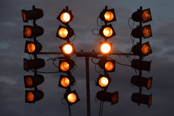 istock spotlight at music event with dark grey sky by night 1026518066
