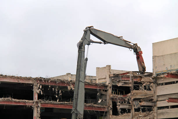 The Dismantling of a Building with a Pulveriser Excavator.