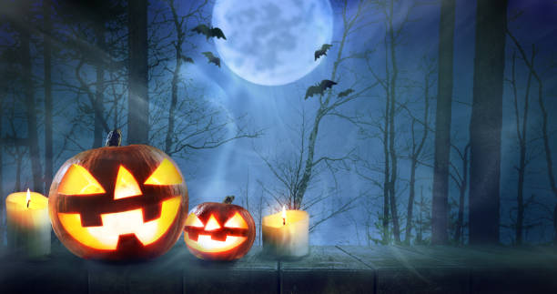istock Halloween pumpkins in forest 1026521182
