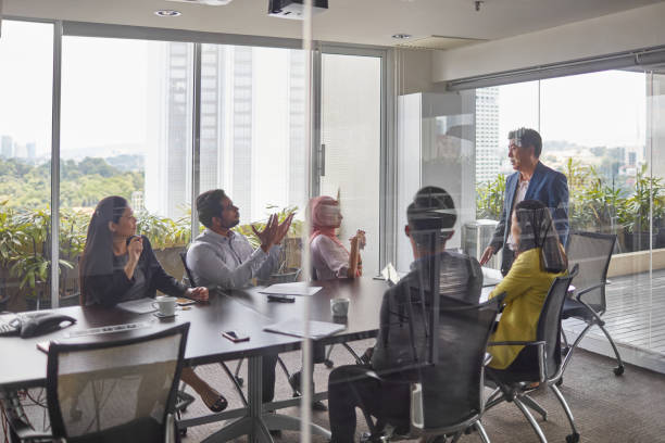 istock Business colleagues discussing in board room 1026524058