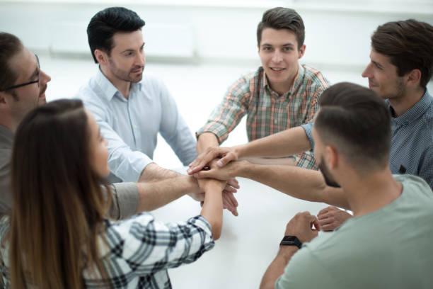istock close up.a successful business team put their hands together 1026528840