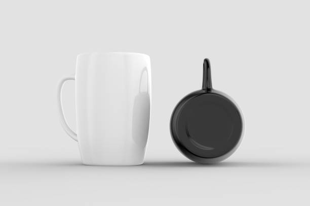 istock Black and white mug mock ups isolated on light gray background. 3D illustration 1026529292
