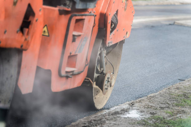 istock Compact steamroller flatten out the asphalt 1026535438