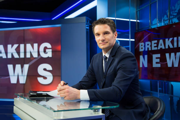 istock Breaking news male anchor 1026540244