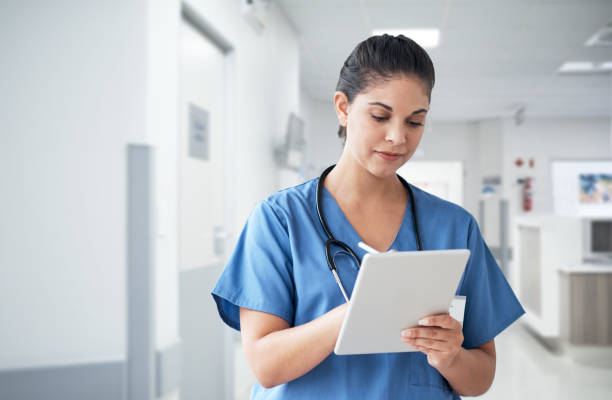 istock Updating her patient files 1026545902