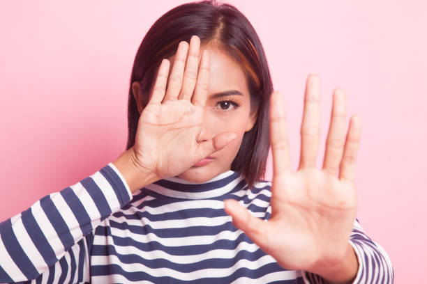istock Young Asian woman hide her  face. 1026550720