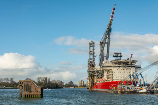 Rotterdam, the Netherlands, February 2, 2018: harbour activities at Heijplaat and beyond it the refineries at Pernis