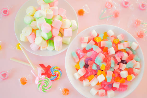 istock Assorted colorful candies on the pink background. 1026551682