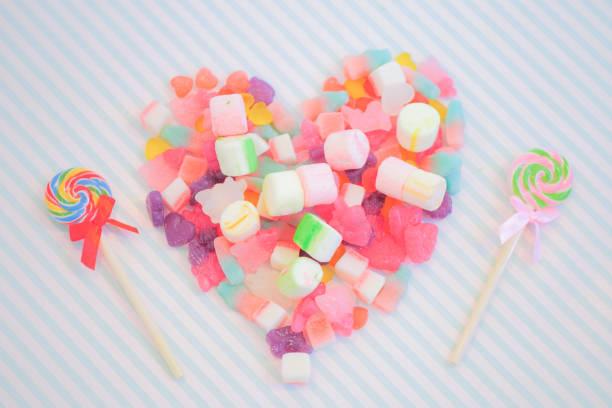istock Assorted colorful candies on the pink background. 1026551824