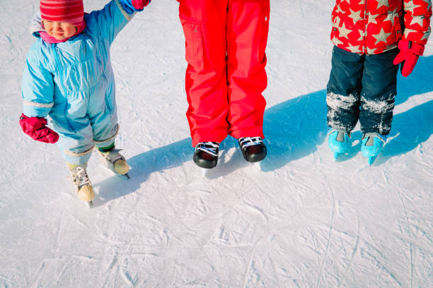 istock father with two kids skating in winter 1026551956