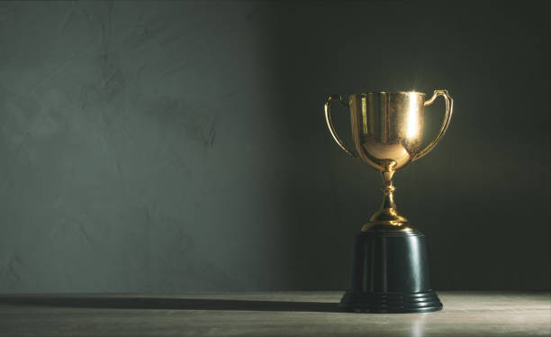 istock champion golden trophy placed on wooden table 1026555064